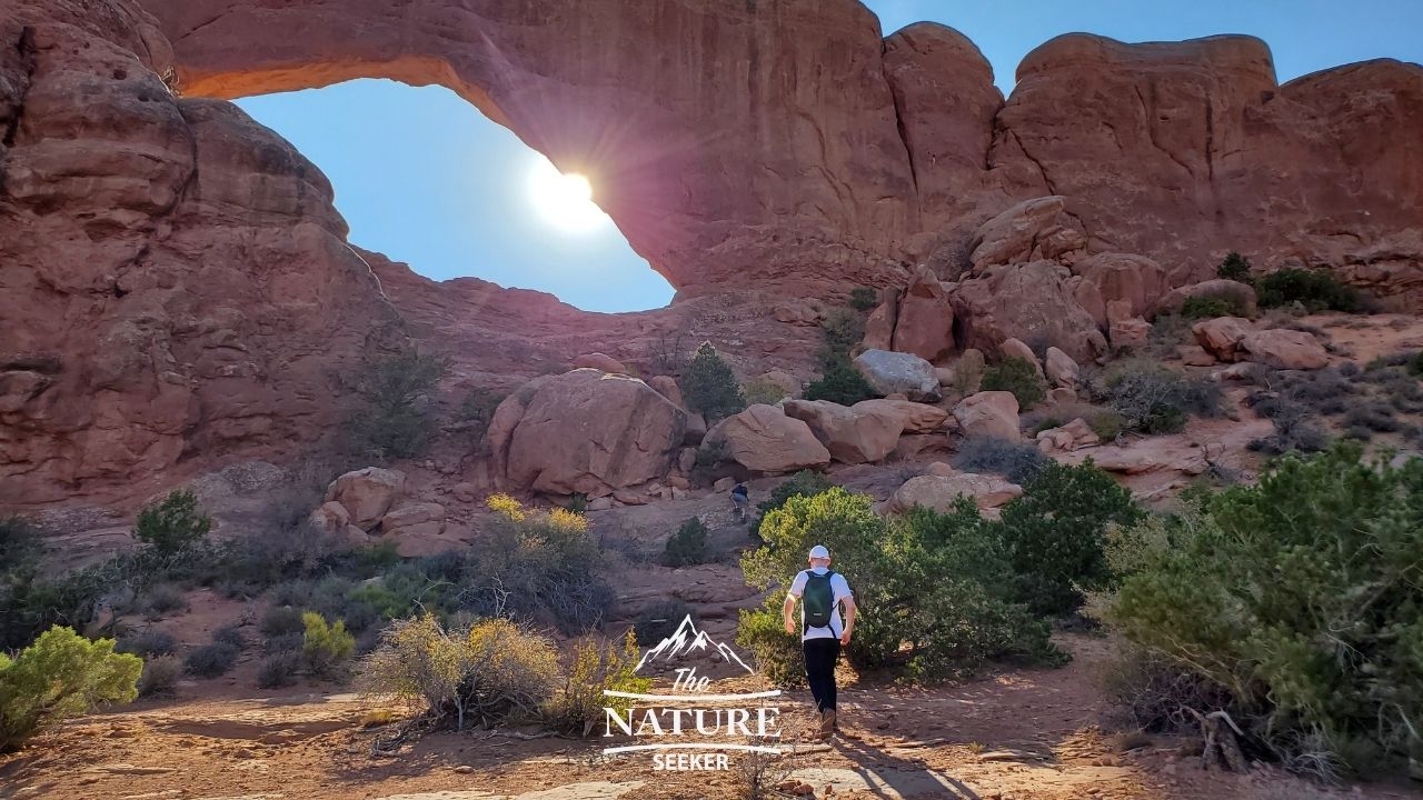 hiking to the south window arch at arches national park 01